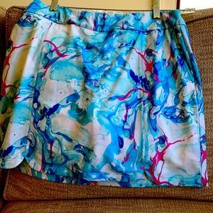 EP NY golf skort, like new. Size medium. Side pockets & one pocket on back.
